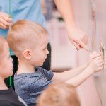 activities with a magnetic board for the development of fine motor skills